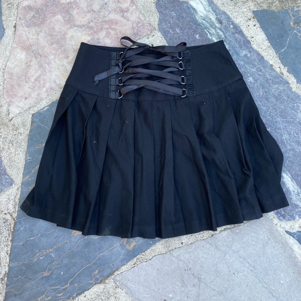 Black pleated skirt with corset detail